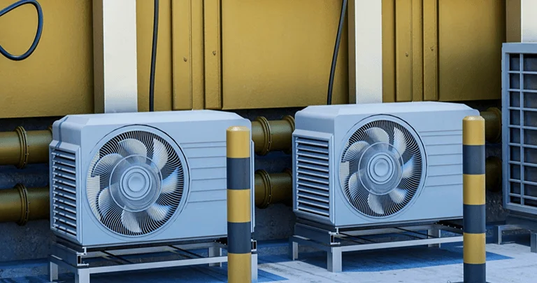 Air conditioning units installed in a large warehouse, providing climate control for the space.
