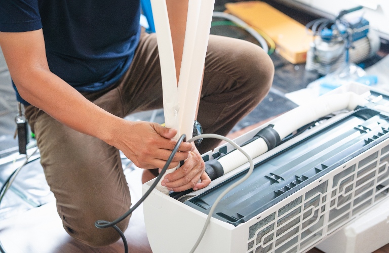 Technician team install new air conditioning