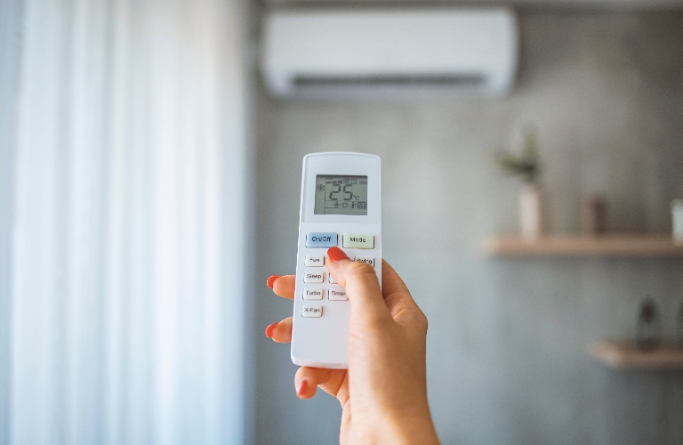 Hand hold remote control directed on the air conditioner